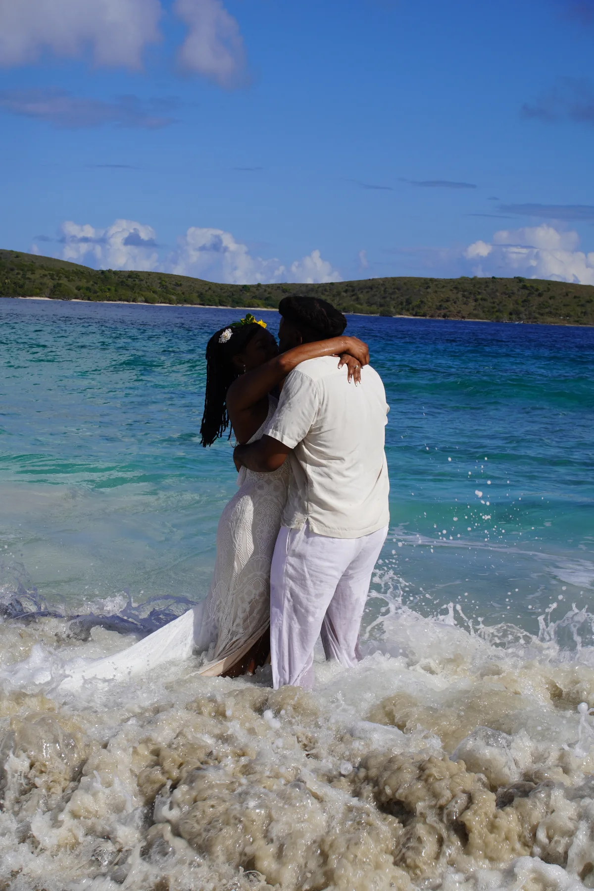 Newlyweds by the shoreline