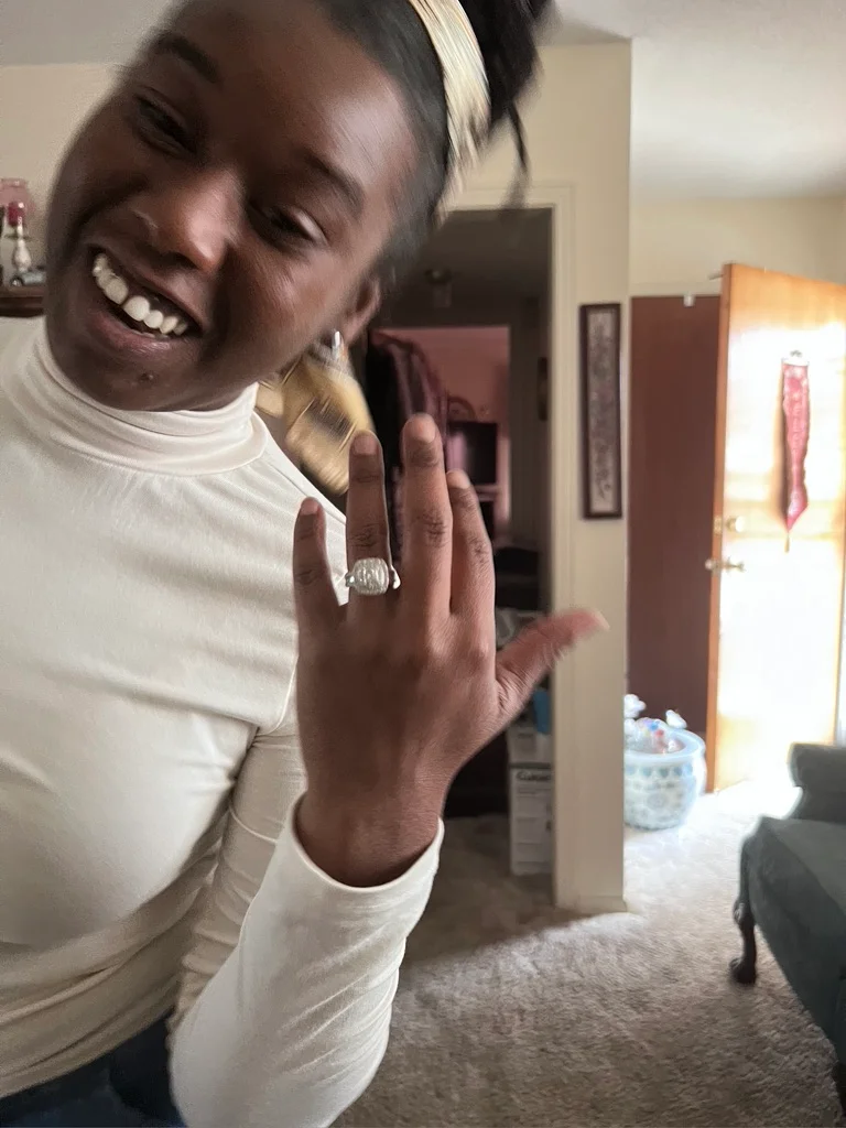 Britney showing her engagement ring after Bryant proposed